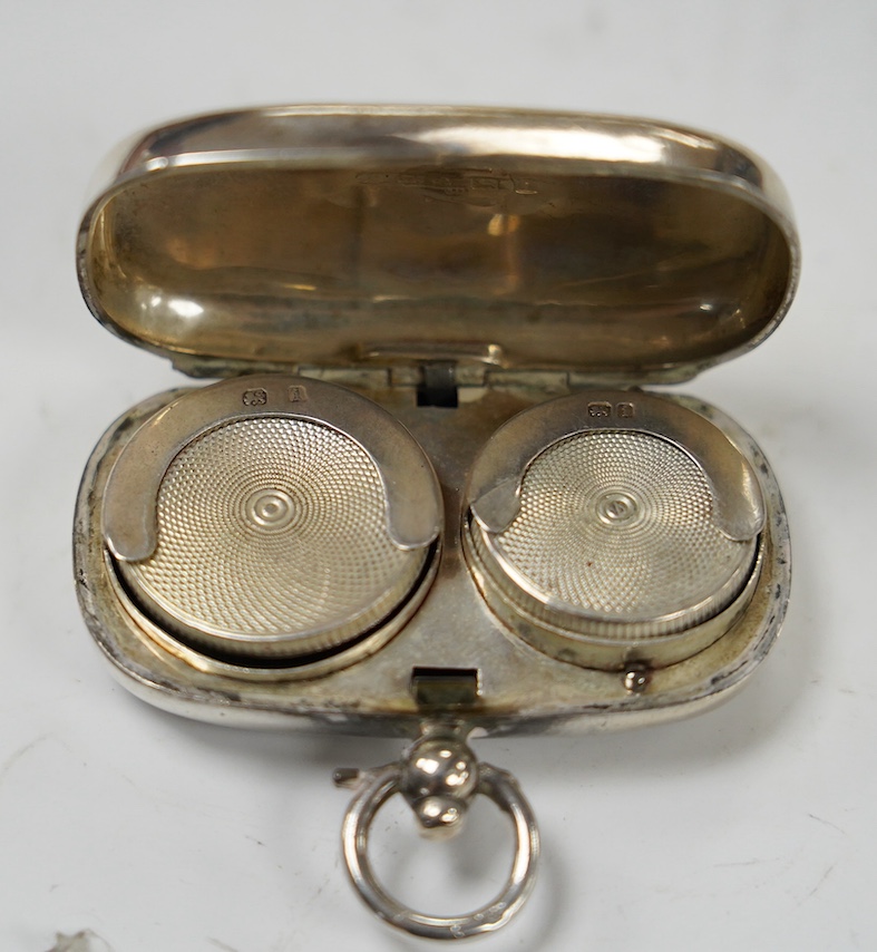 A George V engraved silver sovereign/half sovereign case, Birmingham 1910, 50mm. Condition - fair